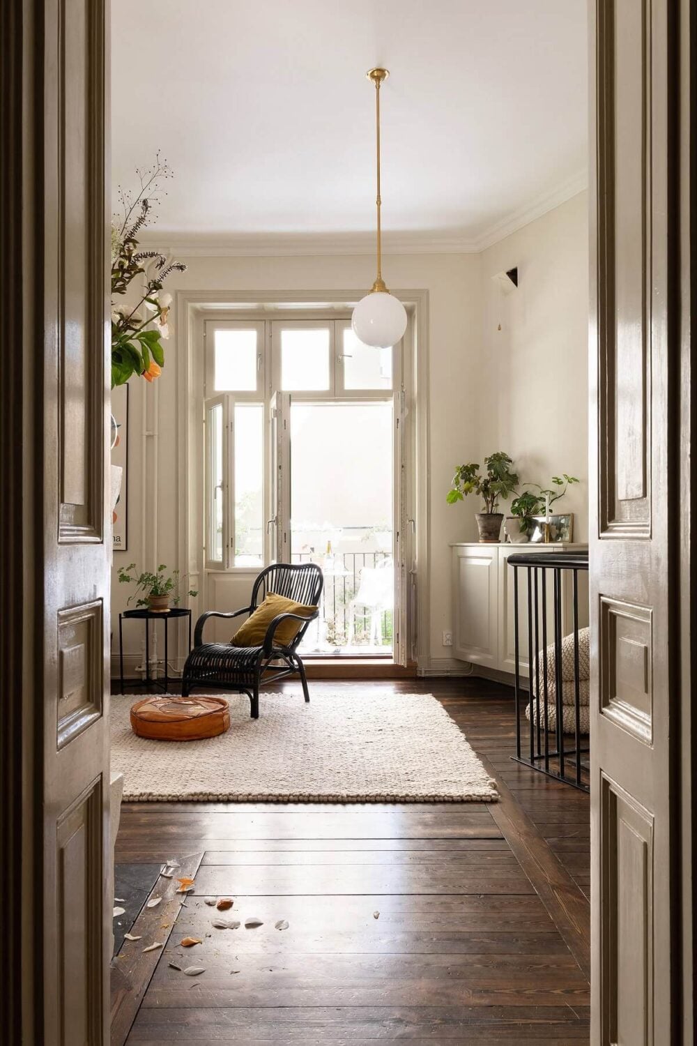 A Classic Maisonette Home in Stockholm 8 living-room-dark-wooden-floor-beige-walls-nordroom