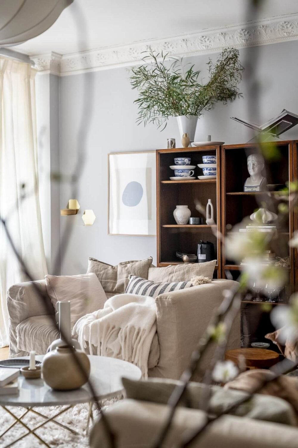 Layered Textiles and Dusty Colors in a Nordic Apartment 5 living-room-detail-ceiling-ornaments-nordroom