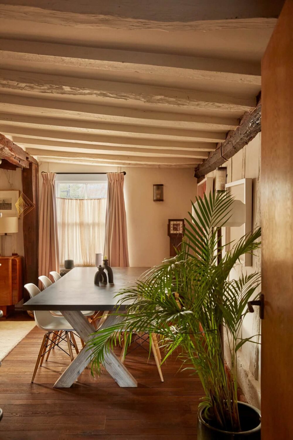 A Pink English Home That's Brimming with History 6 living-room-dining-area-wooden-beams-low-ceiling-nordroom
