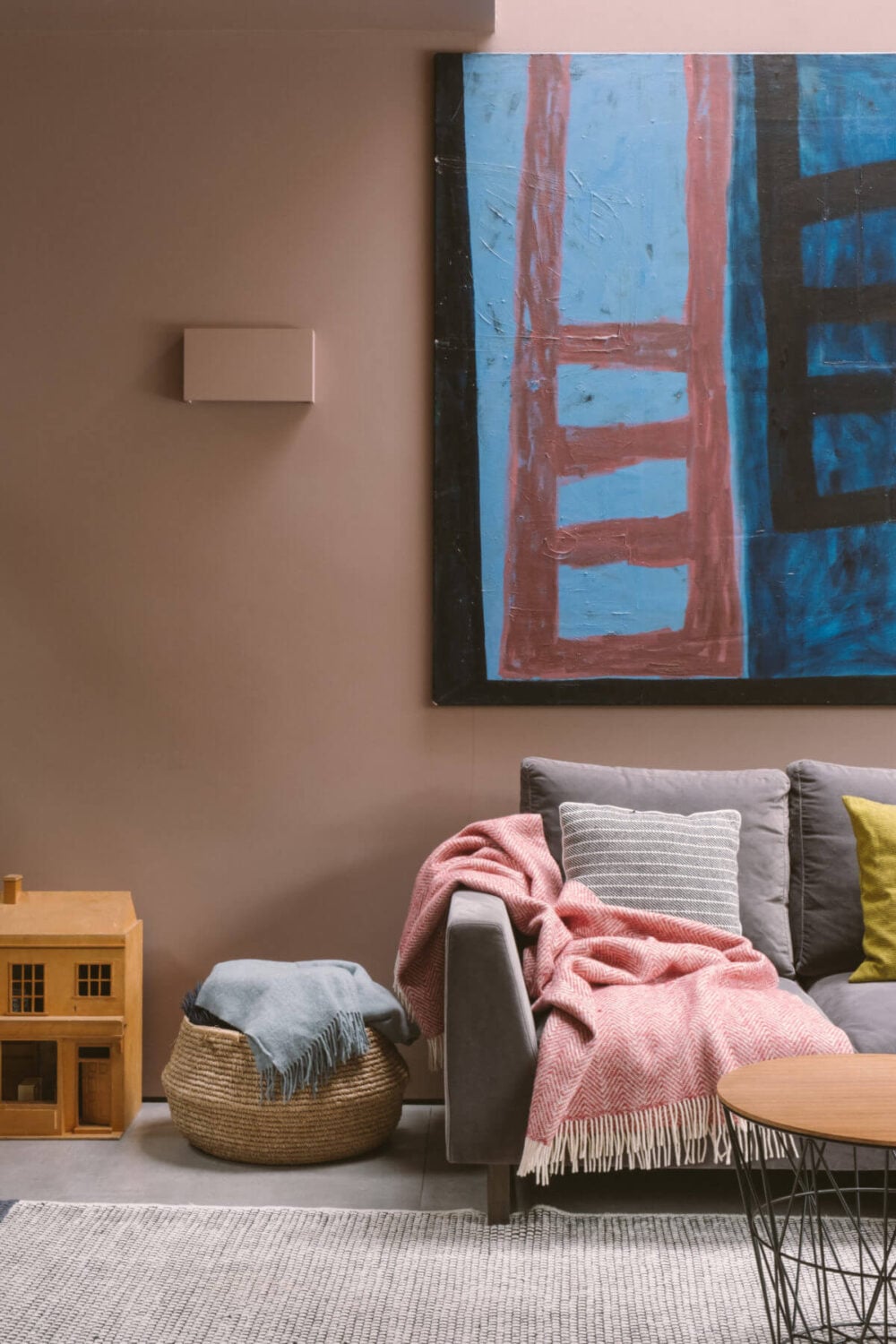 A Modern Split-Level Home with Colorful Rooms 8 living-room-pink-wall-high-ceiling-large-artwork-nordroom