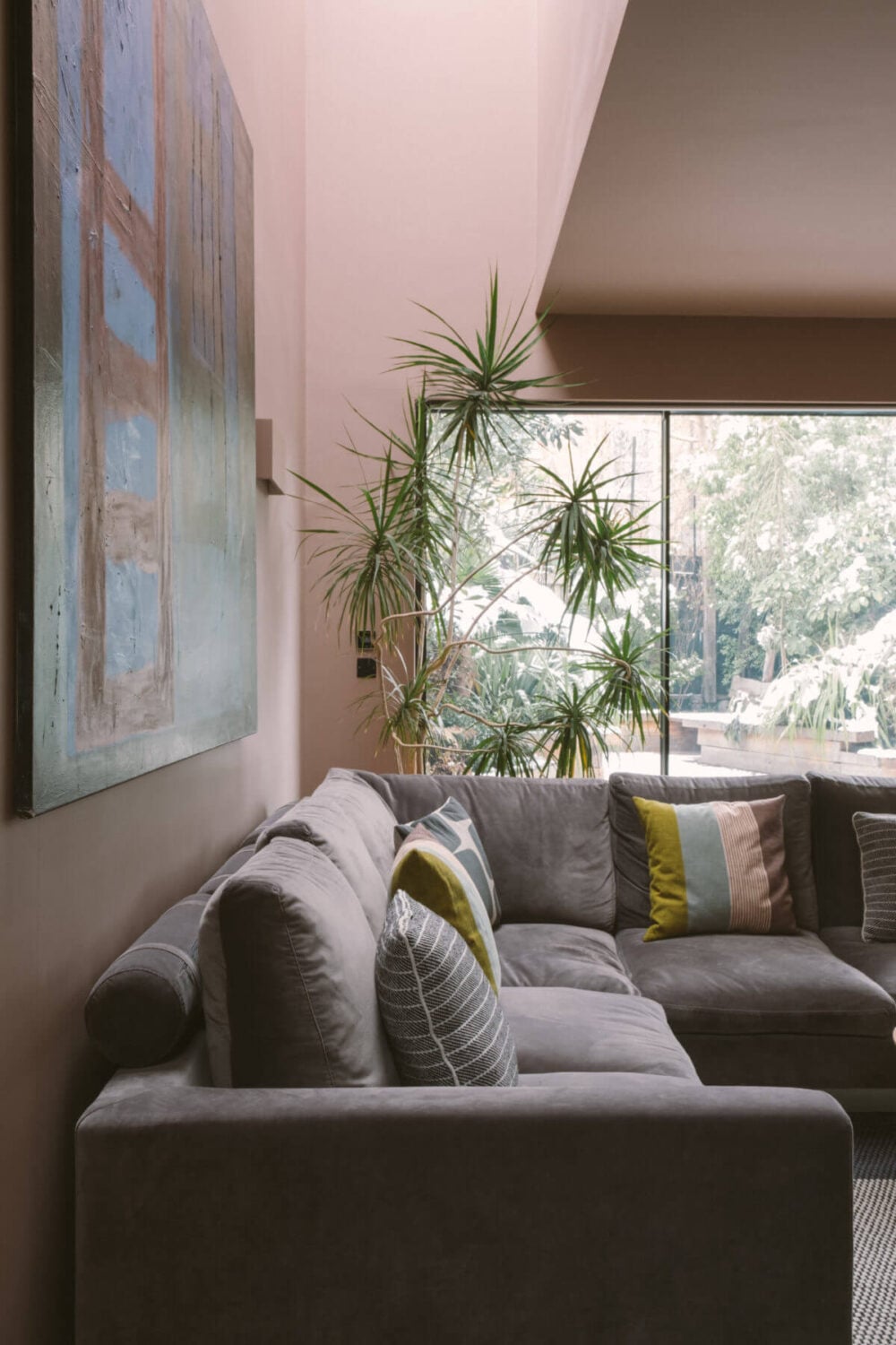 A Modern Split-Level Home with Colorful Rooms 10 living-room-skylight-pink-walls-nordroom