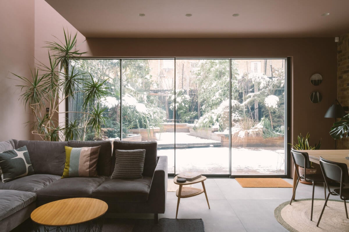 A Modern Split-Level Home with Colorful Rooms 12 modern-living-room-sliding-doors-garden-nordroom