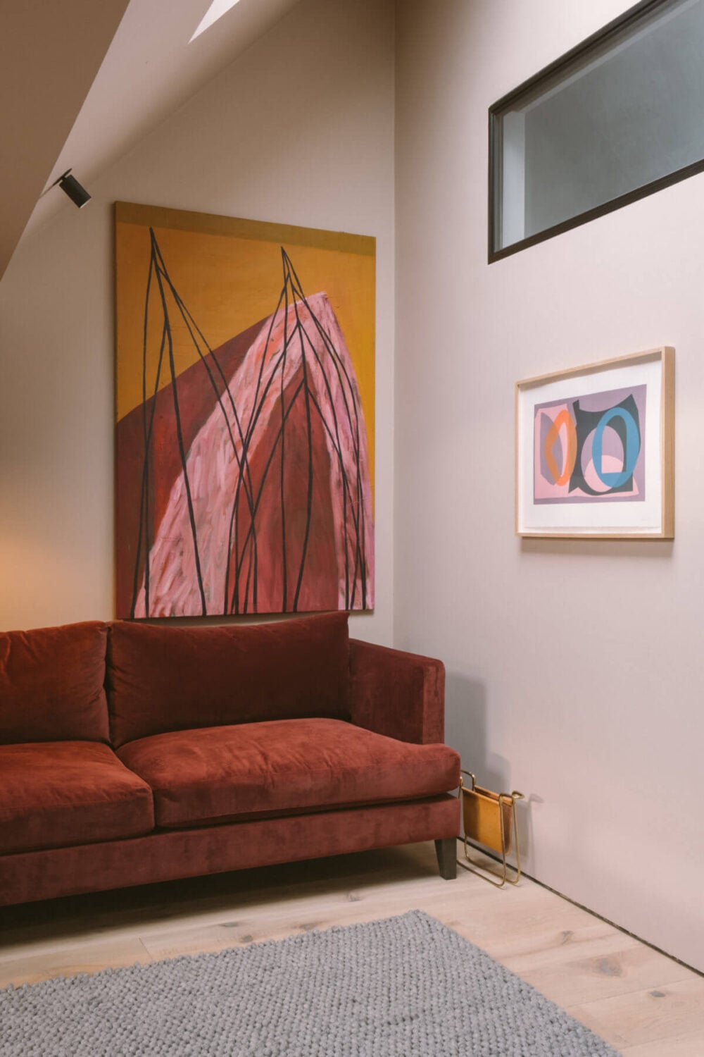 A Modern Split-Level Home with Colorful Rooms 17 red-sofa-art-skylight-snug-split-level-home-nordroom