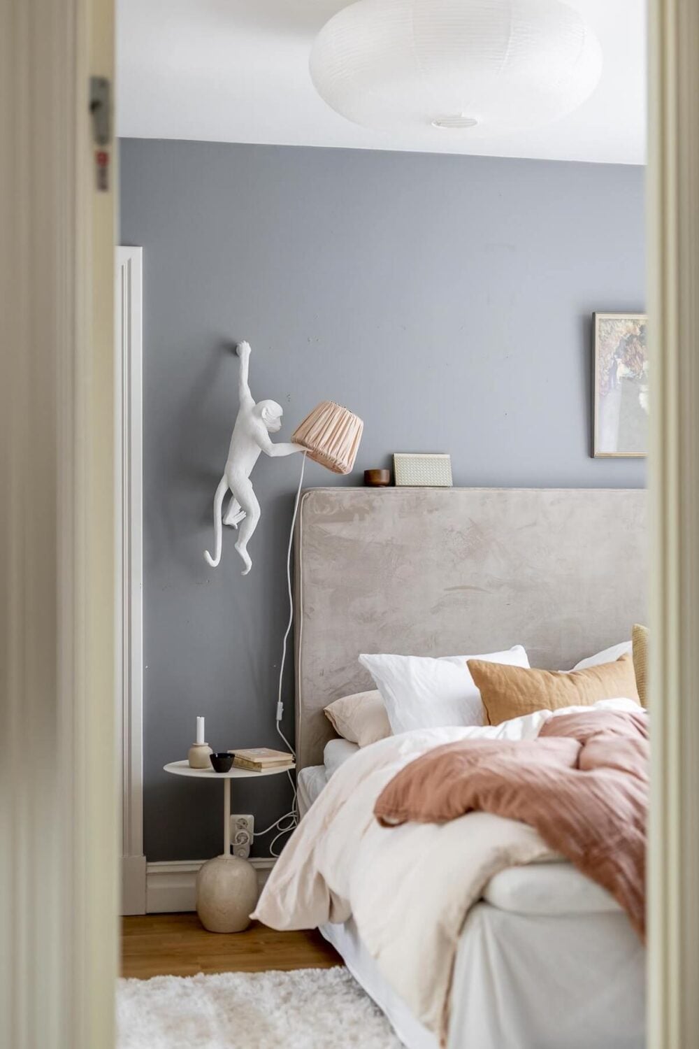 Layered Textiles and Dusty Colors in a Nordic Apartment 13 scandinavian-bedroom-gray-walls-pink-bedding-nordroom