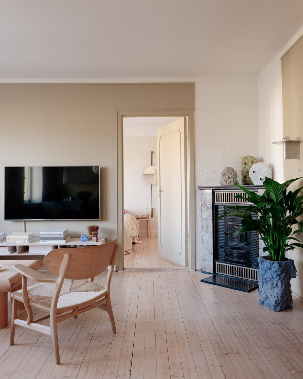 A Modern Oslo Apartment with Custom Furniture and Storage 10 scandinavian-living-room-wooden-floor-fireplace-nordroom