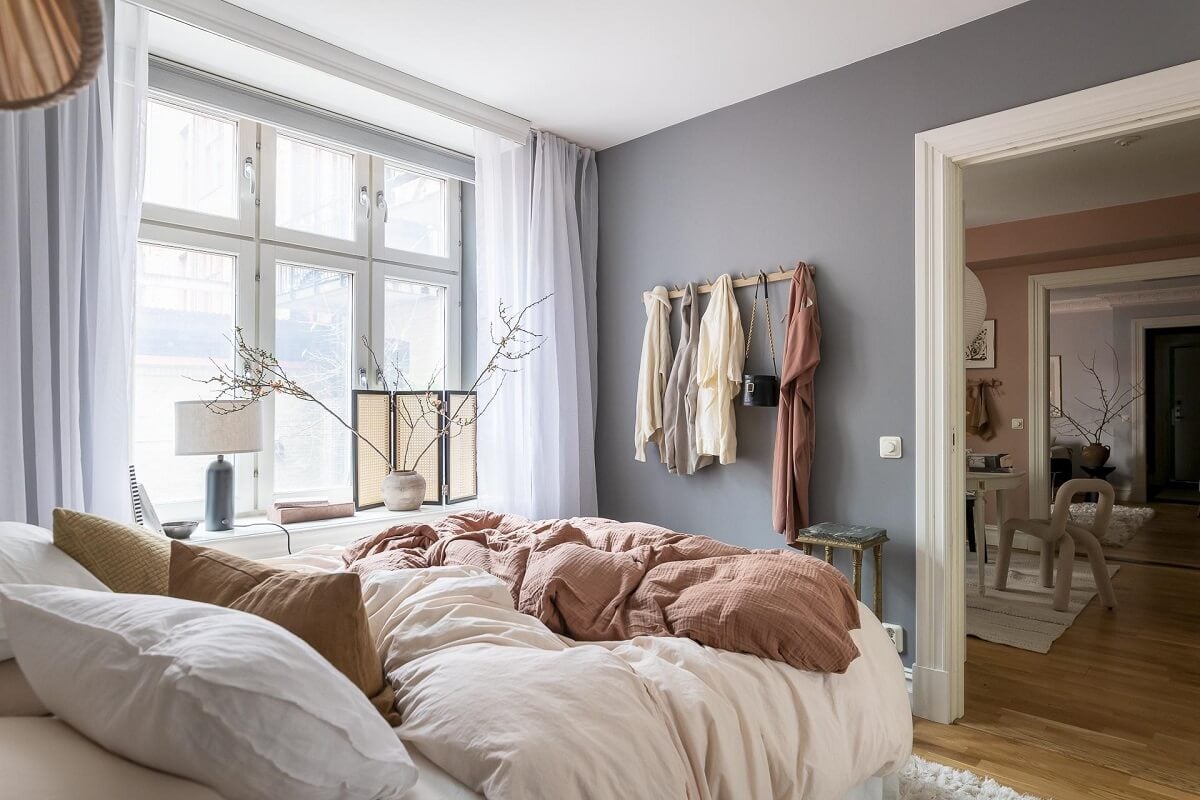 Layered Textiles and Dusty Colors in a Nordic Apartment 16 small-scandinavian-bedroom-gray-walls-nordroom