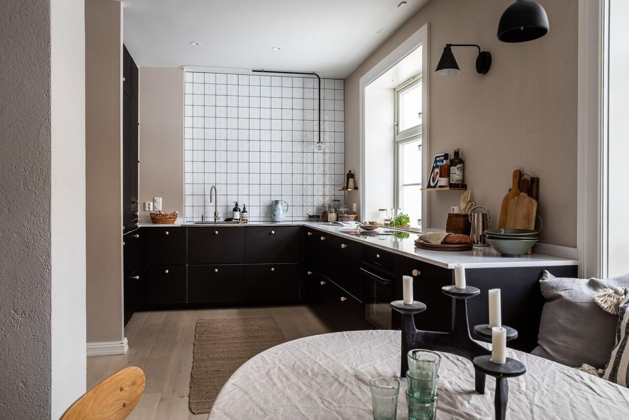Soft Neutral Colors in a Norwegian Maisonette Home 6 spacious-kitchen-dining-area-black-cabinets-nordroom