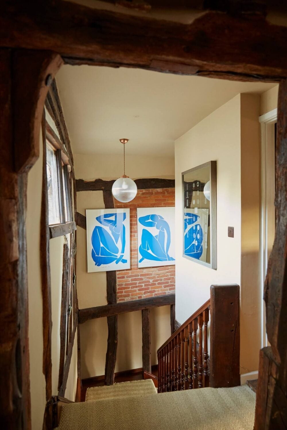 A Pink English Home That's Brimming with History 17 staircase-exposed-wooden-beams-nordroom