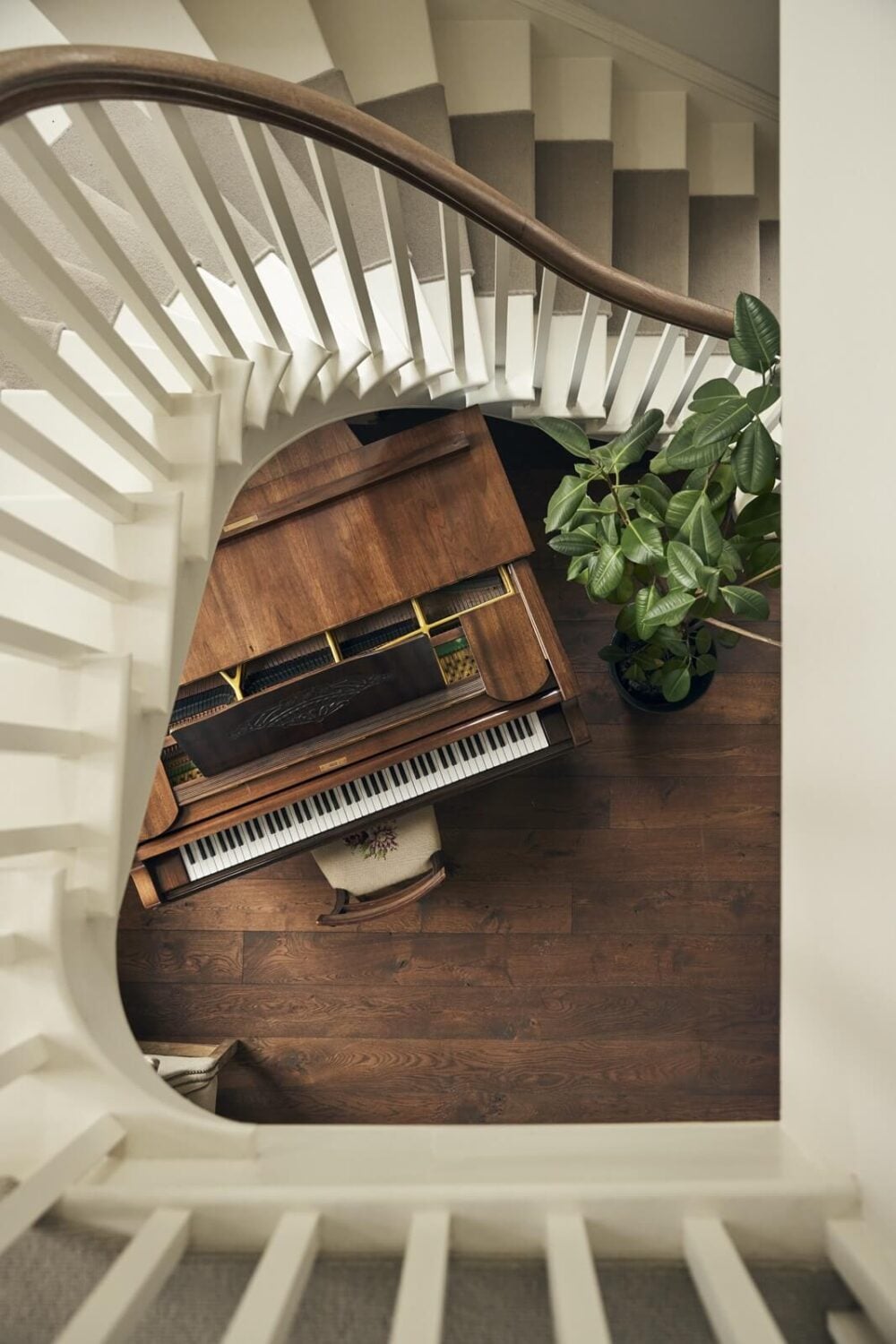 A Peaceful Georgian House in the English Countryside 13 staircase-grand-piano-wooden-floorboards-nordroom