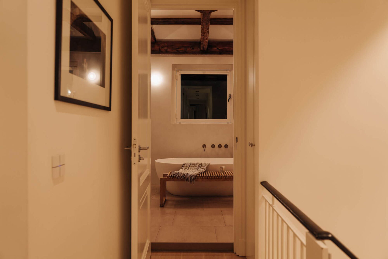A Luxurious Canal Home in Amsterdam 14 view-into-bathroom-exposed-wooden-beams-nordroom