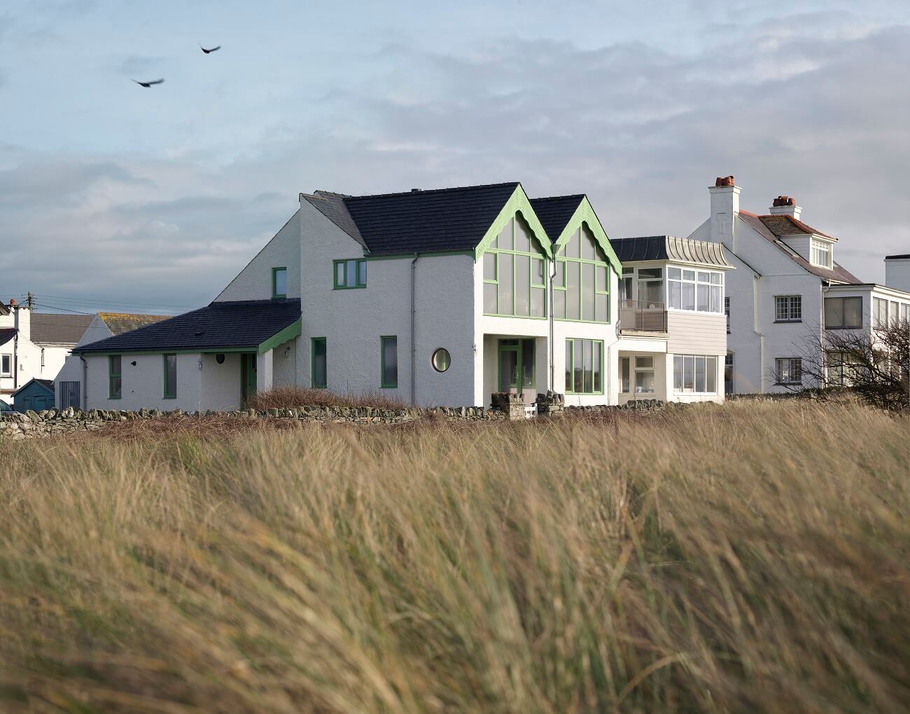 A Colorful House By The Sea Designed by Space A 17 white-exterior-house-by-the-sea-space-a-nordroom