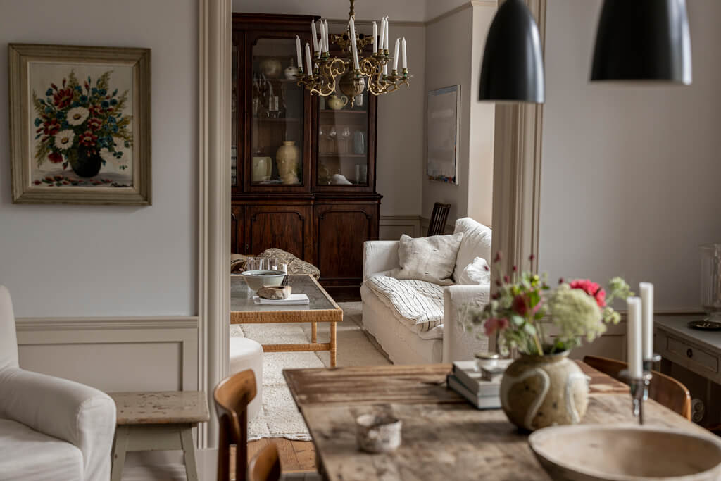 A Scandinavian Apartment with Antique Furniture 2 wooden-dining-table-black-pendants-nordroom