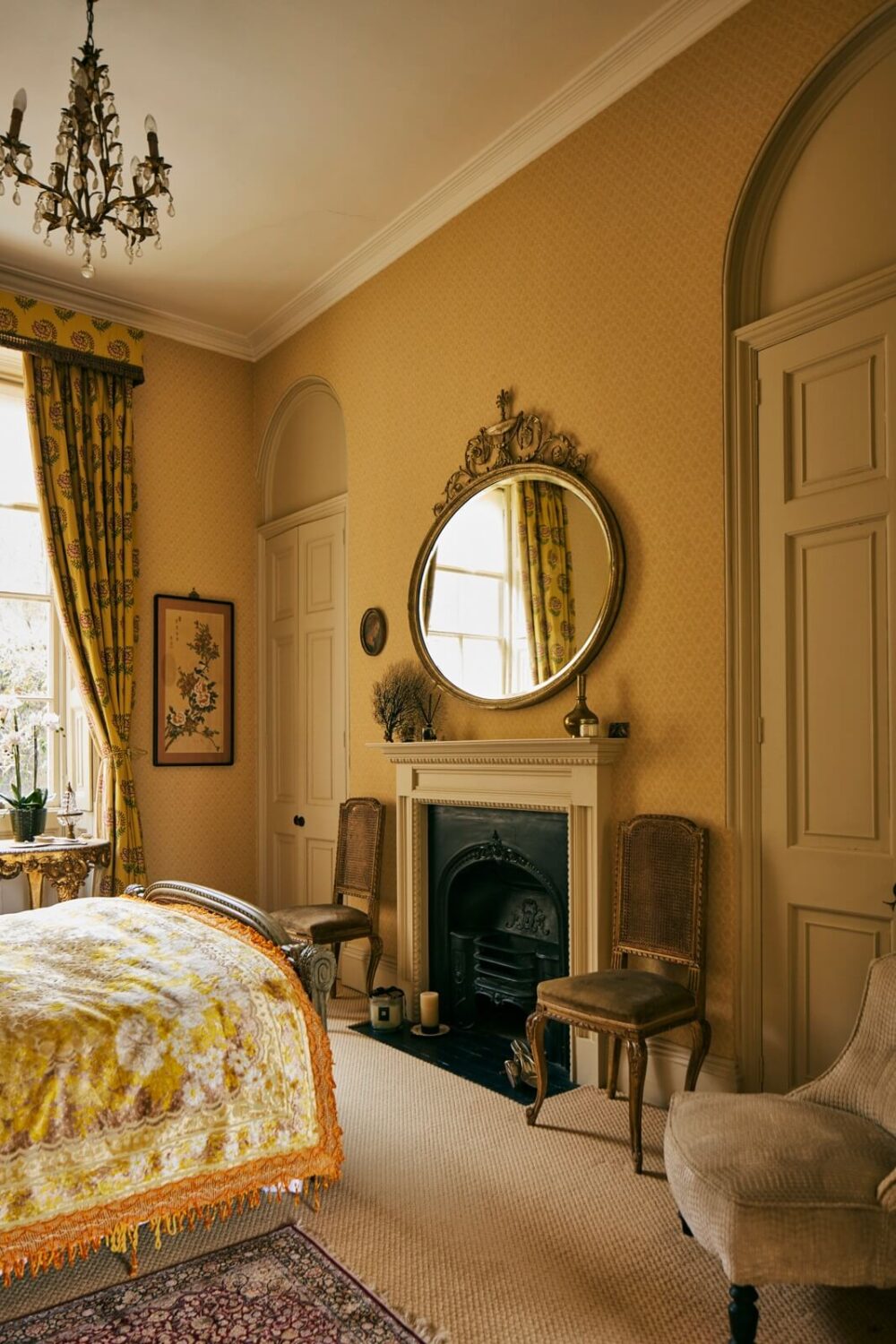 Colorful Rooms and Unique Decor in a Home in Bath 7 antique-bedroom-round-mirror-fireplace-nordroom