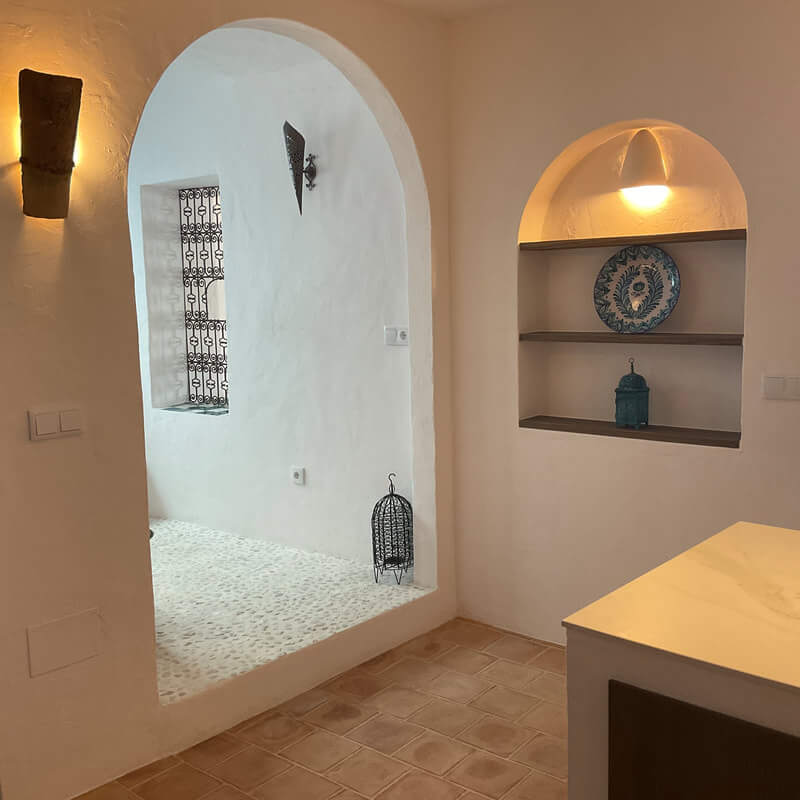 Casita Alborán: A Stylish Home in a Spanish Seaside Town 11 arch-kitchen-indoor-patio-terracotta-floor-nordroom