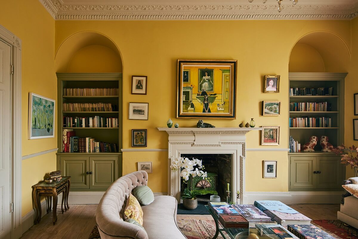 Colorful Rooms and Unique Decor in a Home in Bath 4 arched-niches-bookcases-fireplace-yellow-walls-sitting-room-nordroom