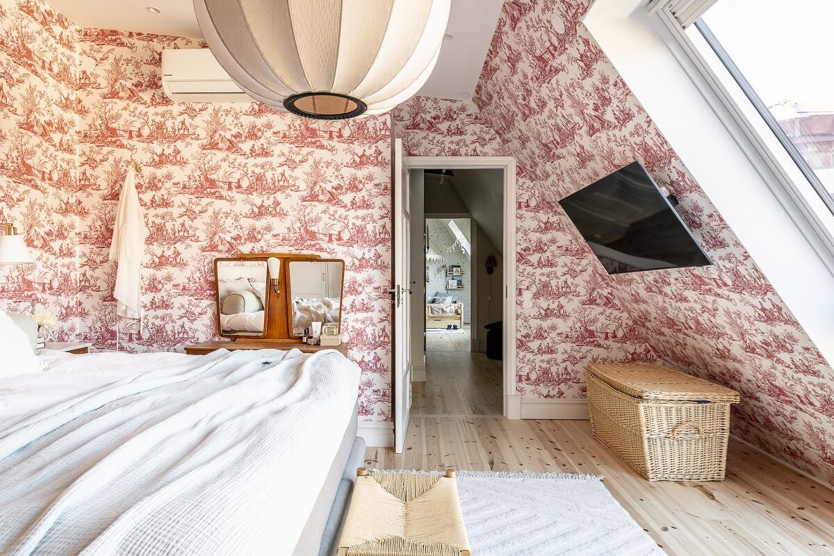 A Swedish Maisonette with a Blue Kitchen and Wallpaper 22 attic-bedroom-pink-wallpaper-slanted-ceiling-nordroom