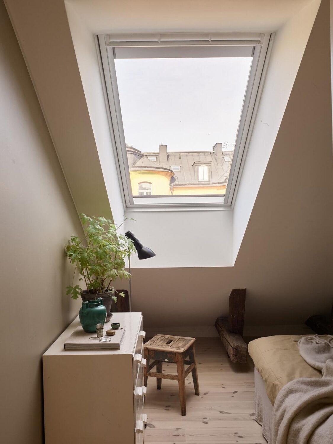 A Scandinavian Penthouse Apartment with Slanted Ceilings 14 attic-bedroom-skylight-wooden-floor-nordroom