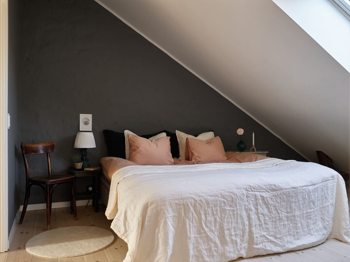 A Scandinavian Penthouse Apartment with Slanted Ceilings 16 attic-bedroom-slanted-ceiling-penthouse-nordroom