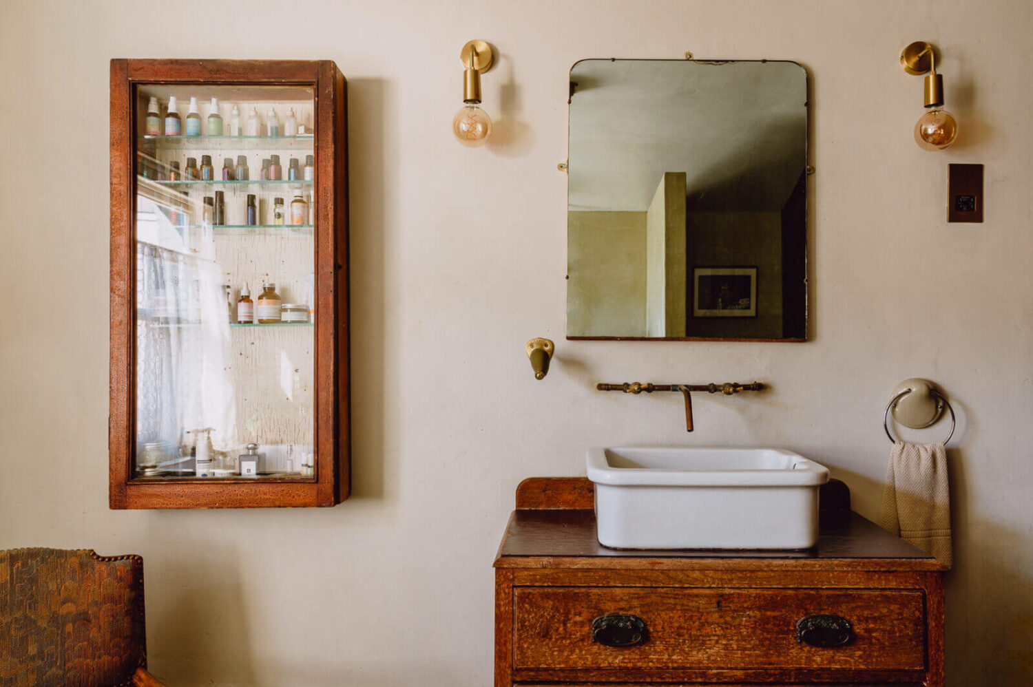 A Victorian Watch Shop is Now a Warm Sustainable Home 21 bathroom-antique-vanity-plaster-walls-nordroom