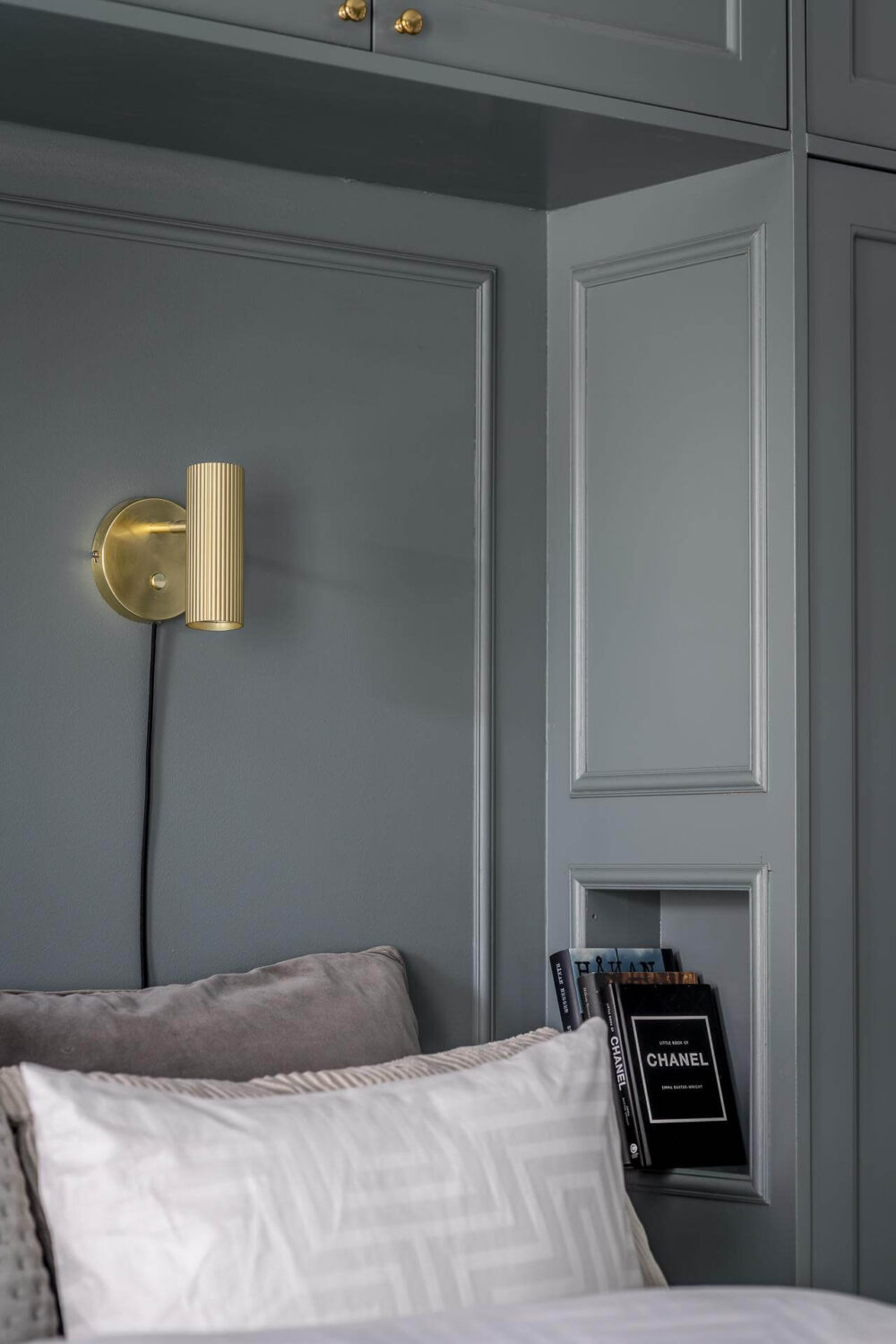 Gray Tones in a Classic Historic Scandinavian Home 8 bedroom-detail-small-niche-books-sconce-nordroom