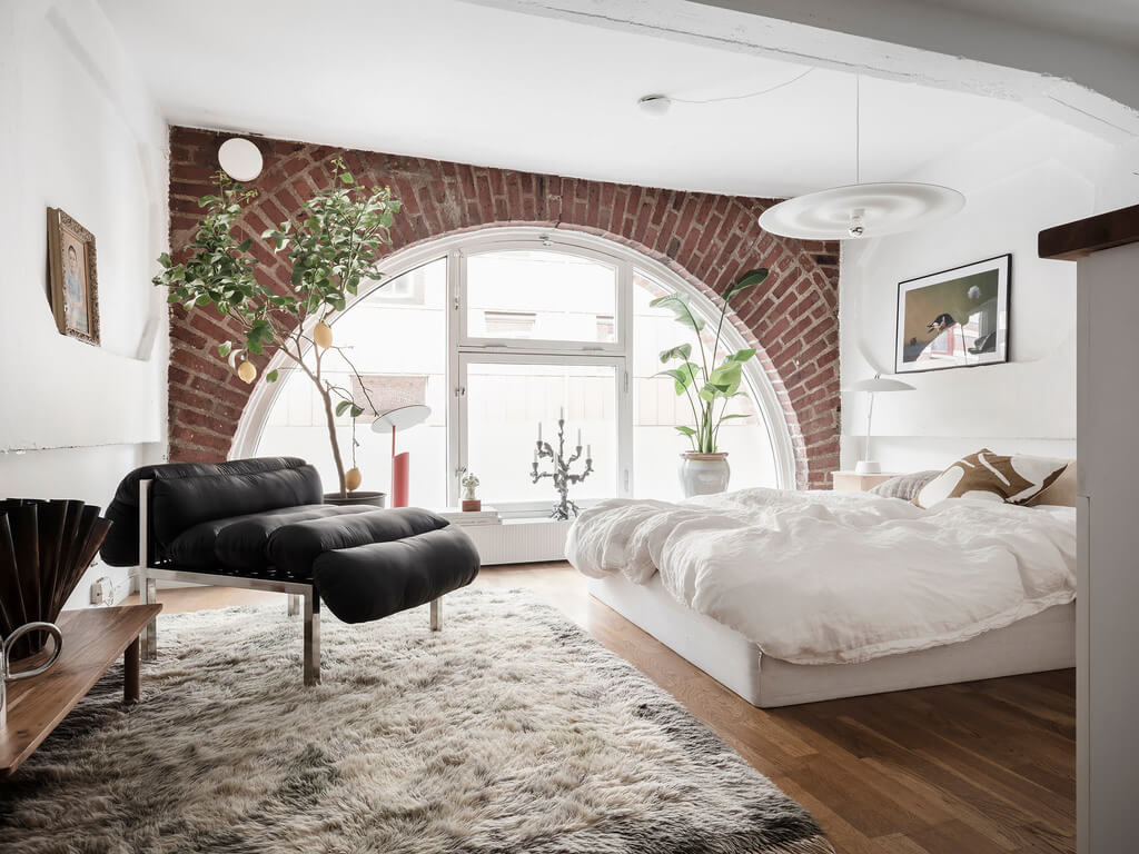 A Scandinavian Loft with Brick Wall and Arched Window 6 bedroom-exposed-brick-wall-arched-window-loft-nordroom