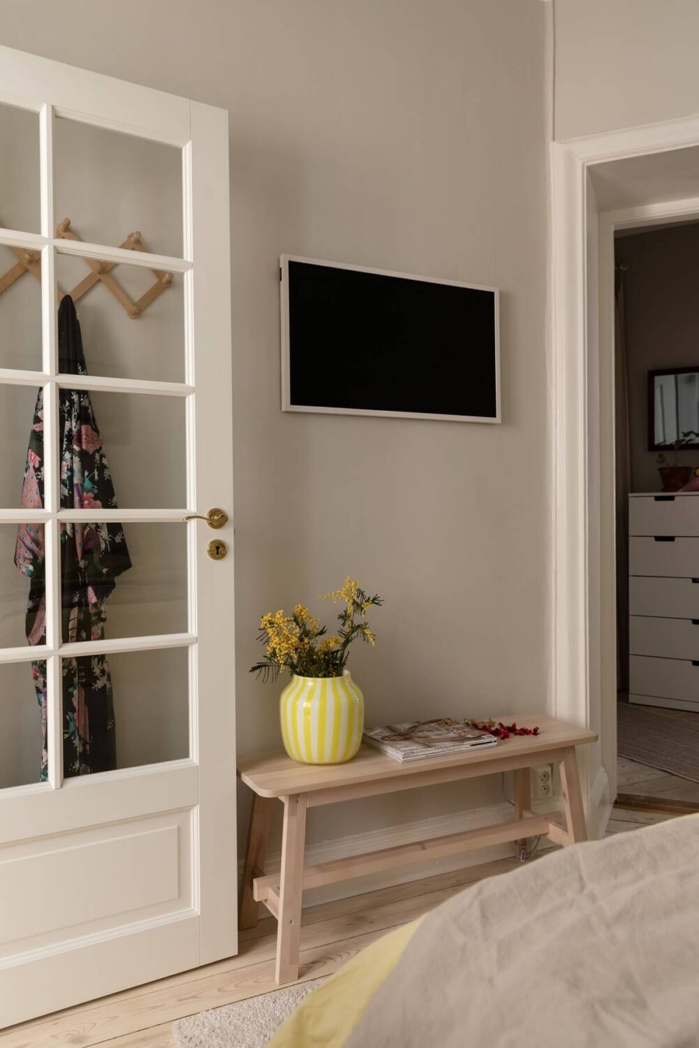 A Pink Living Room in a Scandinavian Apartment 14 bedroom-light-gray-walls-wooden-floor-nordroom
