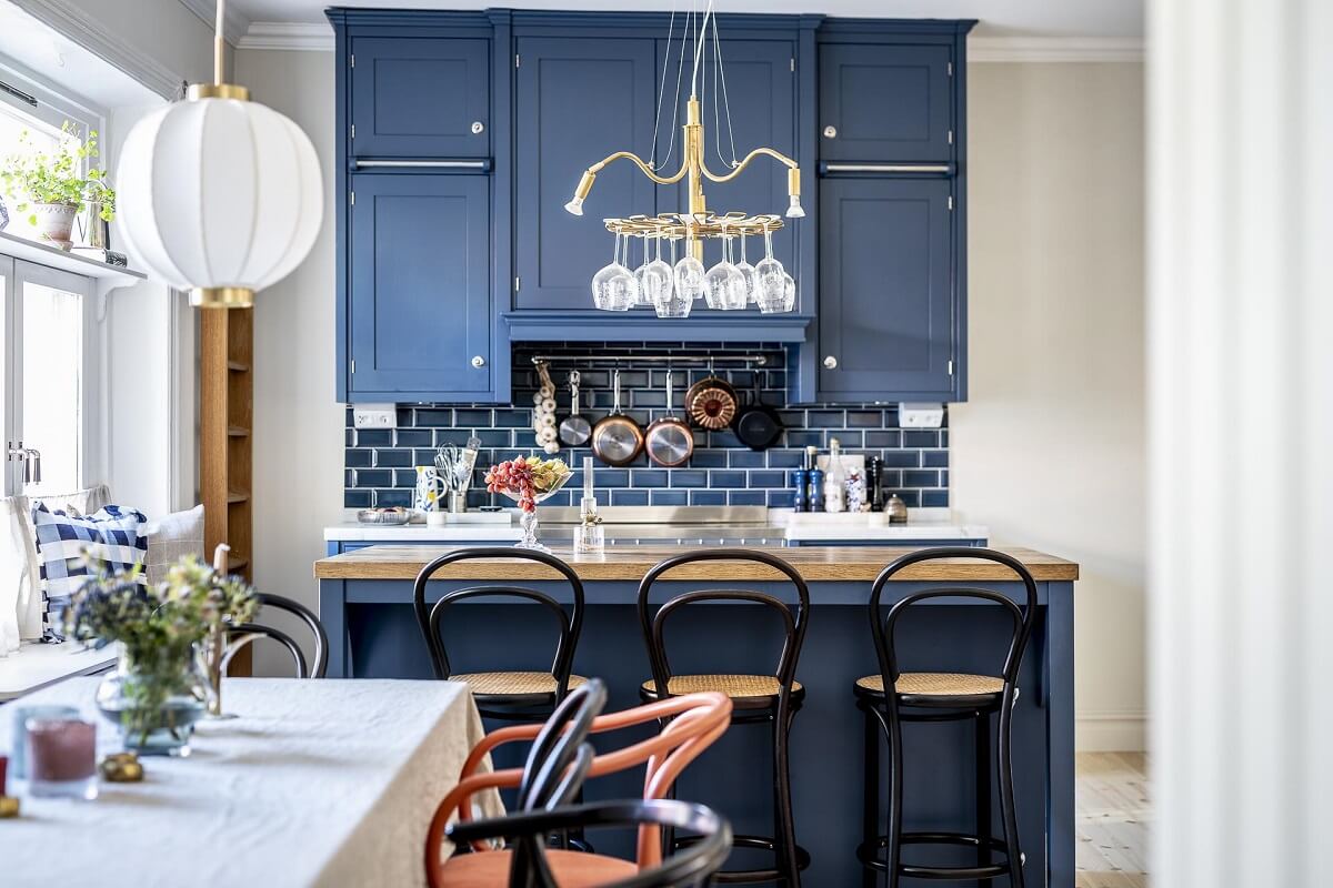 A Swedish Maisonette with a Blue Kitchen and Wallpaper 9 blue-kitchen-cabinets-island-breakfast-bar-nordroom