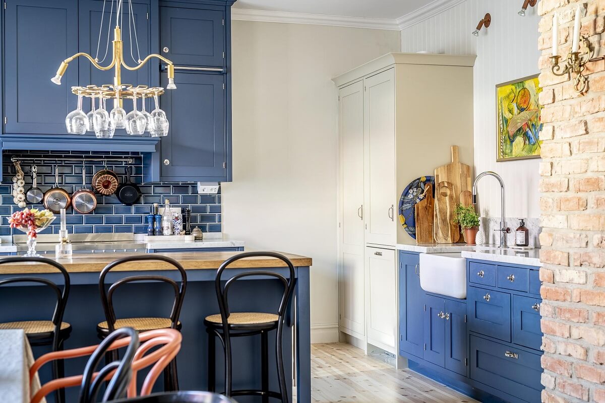 Benjamin Moore Color of the Year 2024: Blue Nova 21 blue-kitchen-cabinets-tiles-brick-wall-nordroom