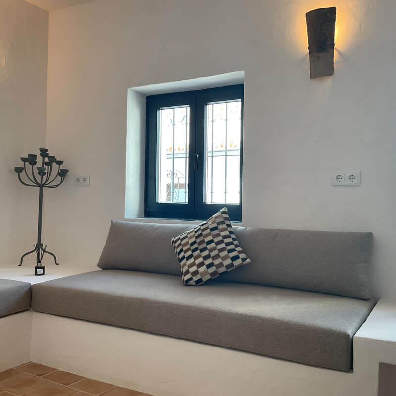 Casita Alborán: A Stylish Home in a Spanish Seaside Town 6 built-in-sofa-spanish-home-nordroom