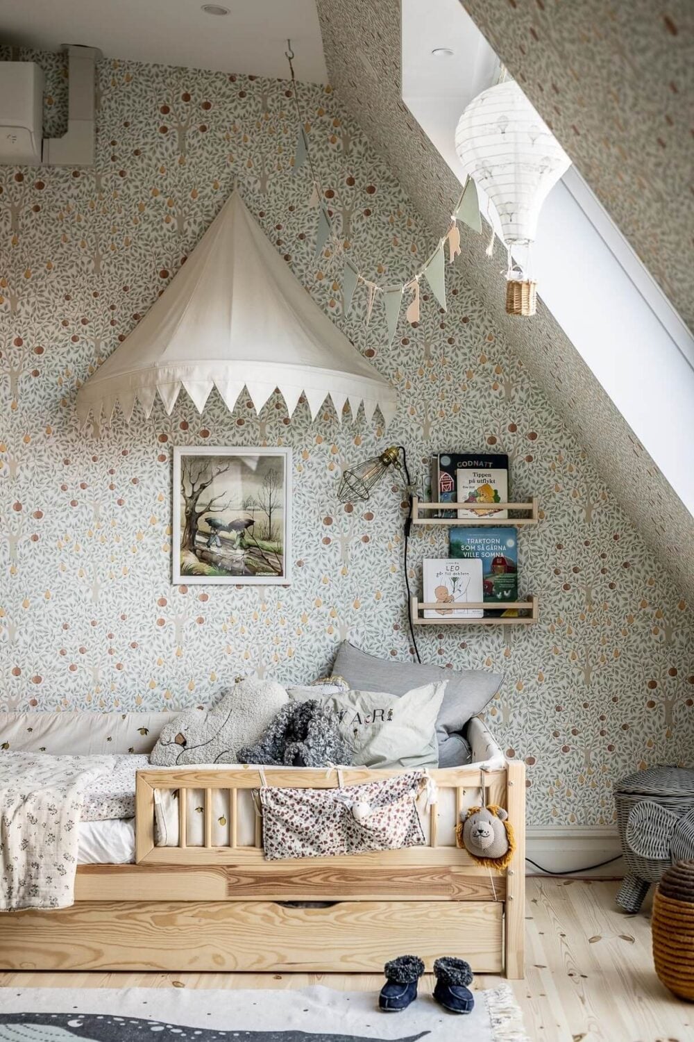 A Swedish Maisonette with a Blue Kitchen and Wallpaper 33 children-room-tree-wallpaper-slanted-ceiling-nordroom