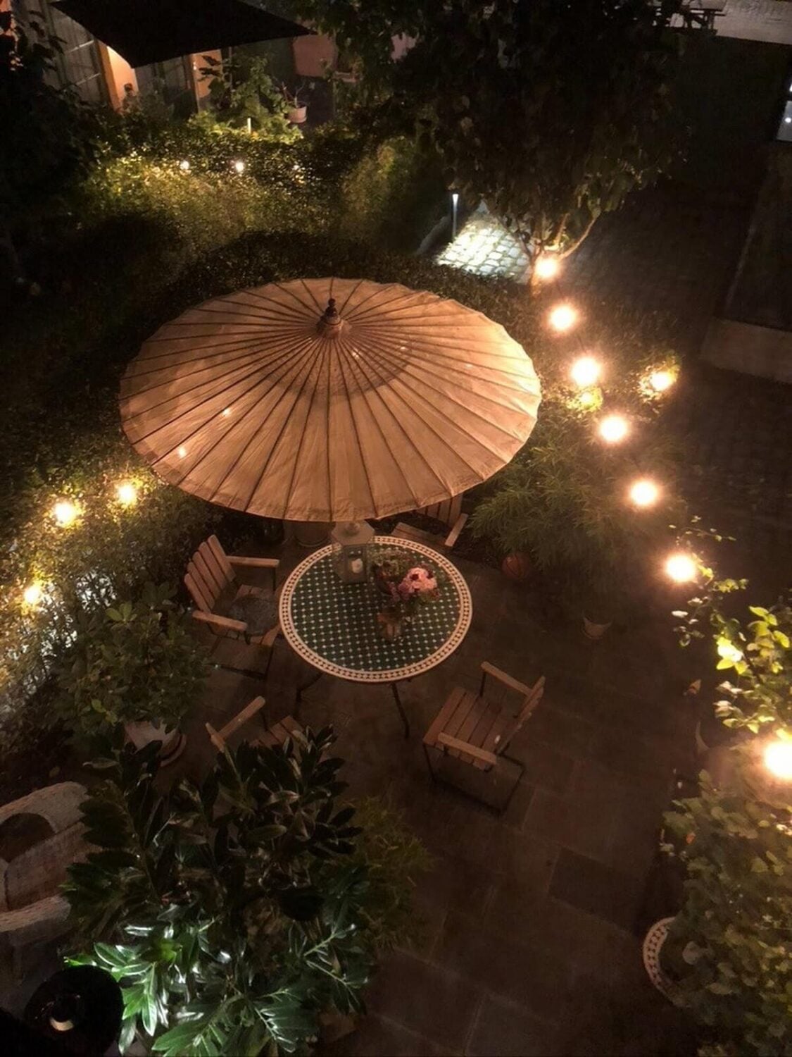 A Swedish Townhouse with a Light Green Kitchen 18 garden-at-night-string-lights-nordroom