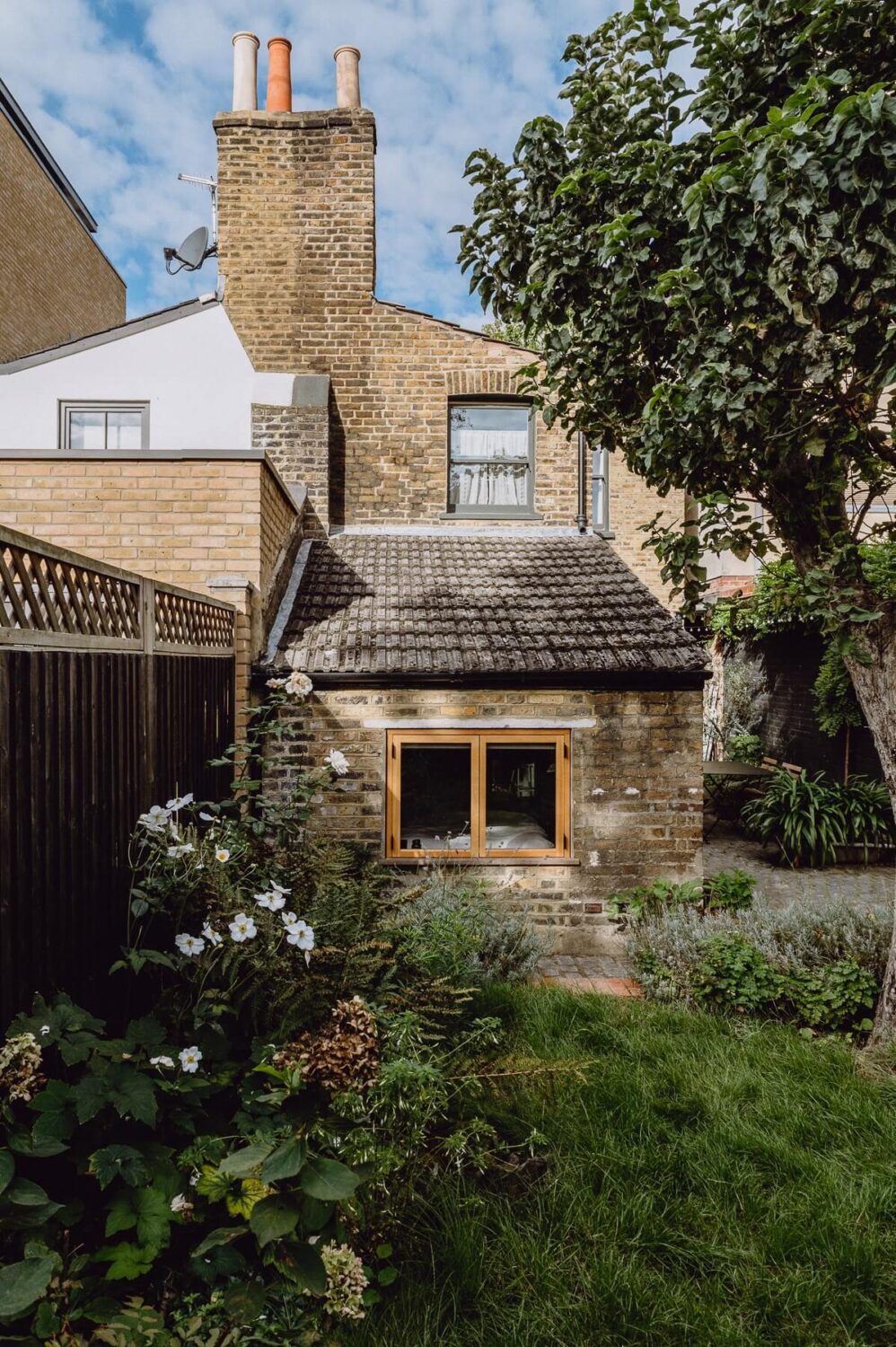 A Victorian Watch Shop is Now a Warm Sustainable Home 24 garden facade victorian house london nordroom