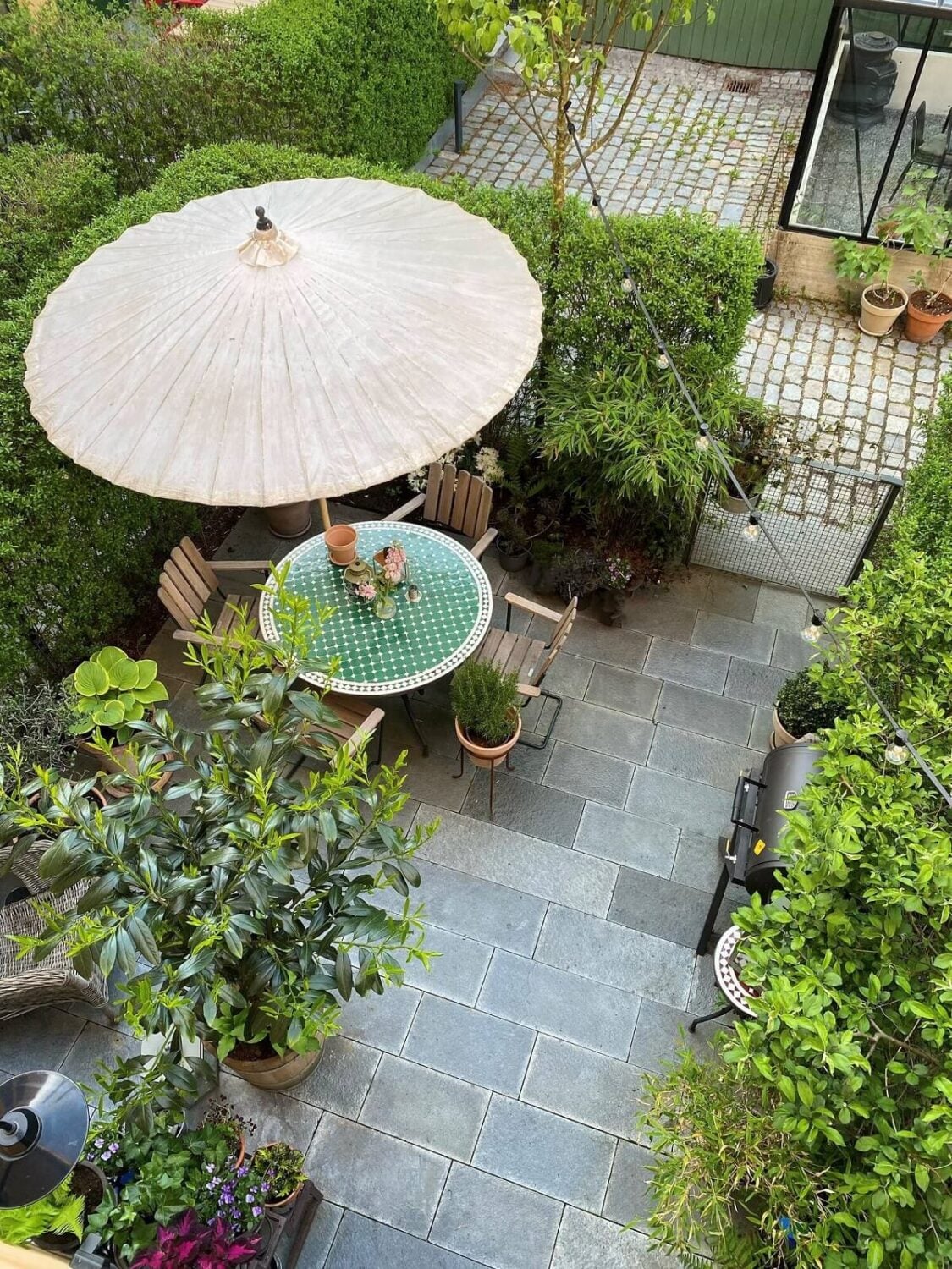 A Swedish Townhouse with a Light Green Kitchen 16 garden-terrace-swedish-townhouse-nordroom