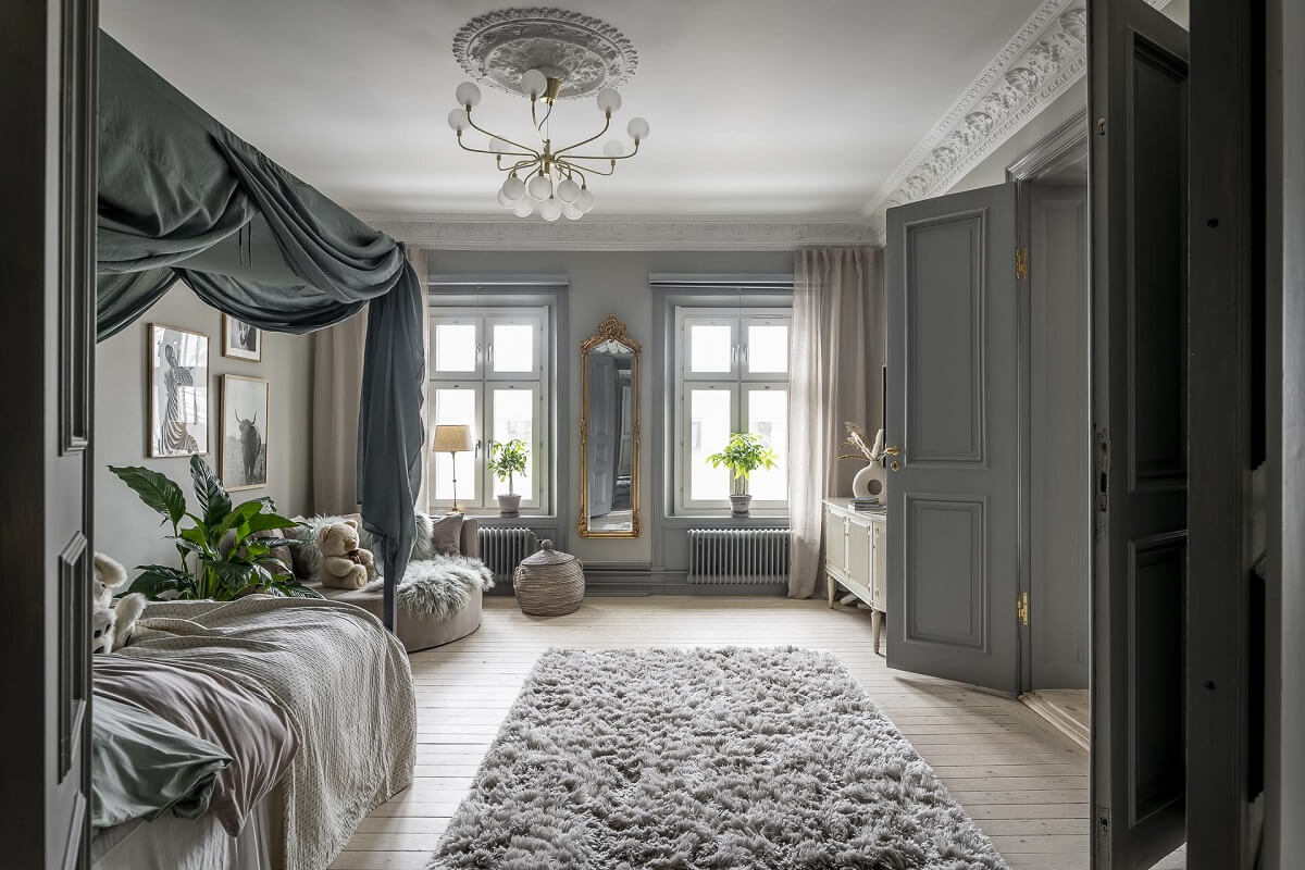 Gray Tones in a Classic Historic Scandinavian Home 23 gray-children-bedroom-rug-canopy-bed-nordroom