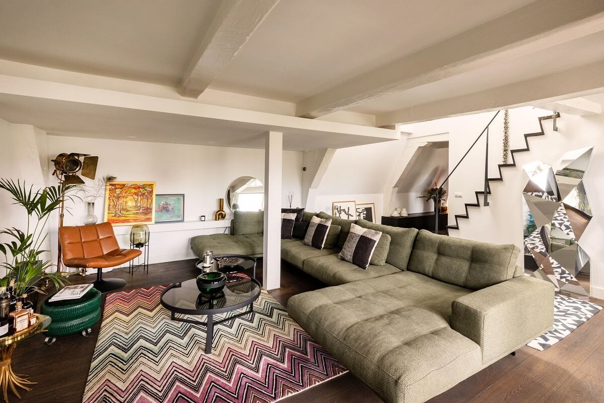 An Amsterdam Penthouse with Green Color Accents 5 green-sofa-living-room-wooden-beams-nordroom
