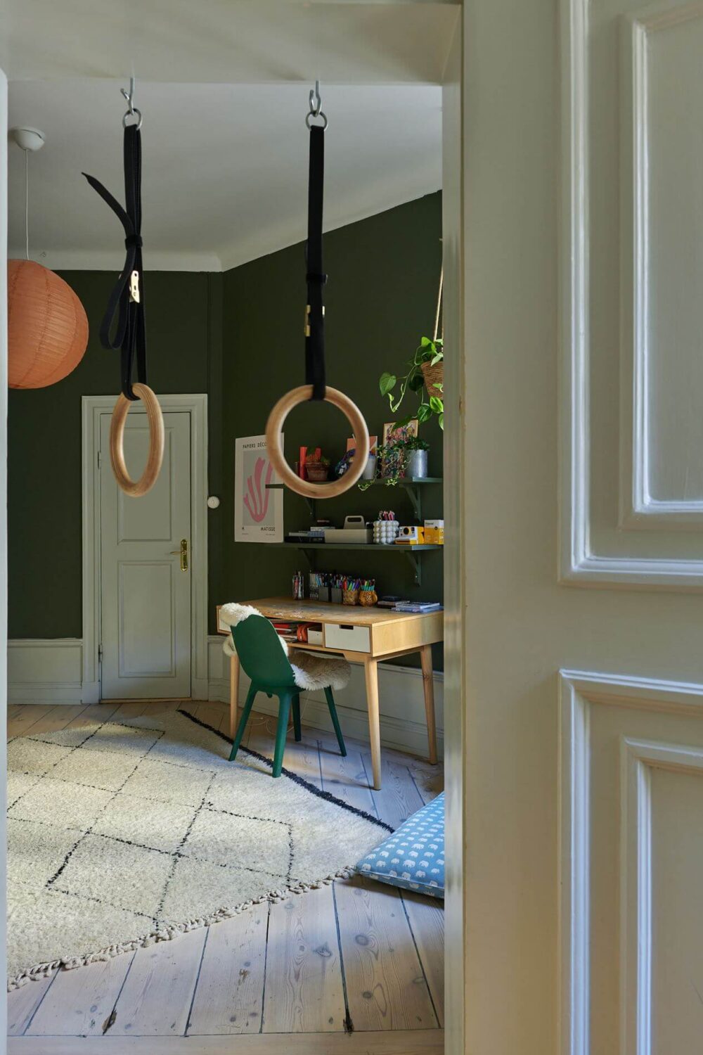 Light Brown Walls in a 17th Century Apartment in Sweden 16 green-walls-kids-bedroom-desk-hanging-rings-wooden-floor-nordroom