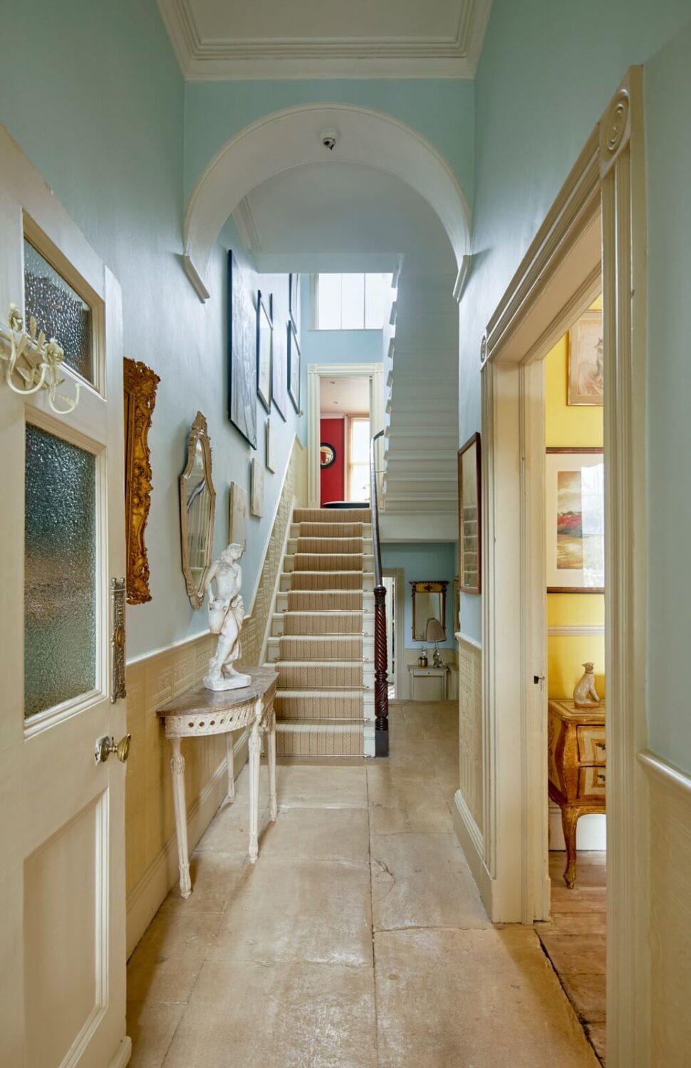 Colorful Rooms and Unique Decor in a Home in Bath 12 hallway-aged-flagstone-floor-light-blue-walls-nordroom