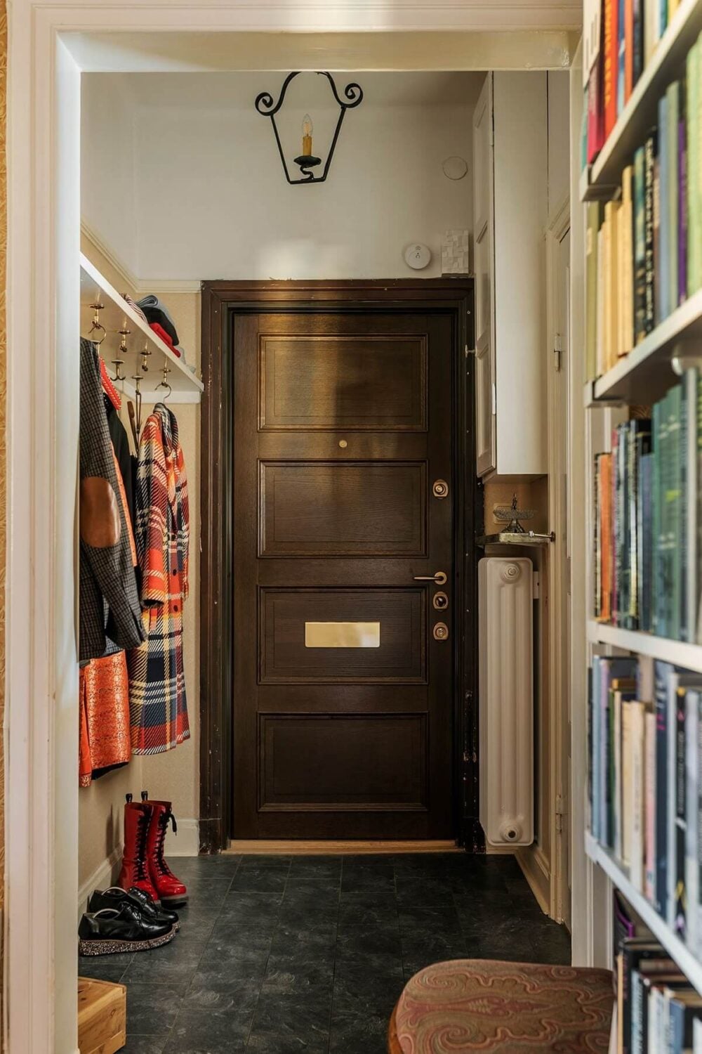 A Vintage Home with a Cozy Reading Room 14 hallway-bookshelves-vintage-apartment-nordroom