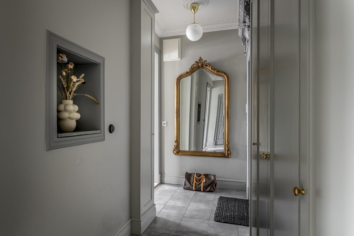 Gray Tones in a Classic Historic Scandinavian Home 27 hallway-built-in-cabinets-gold-antique-mirror-nordroom
