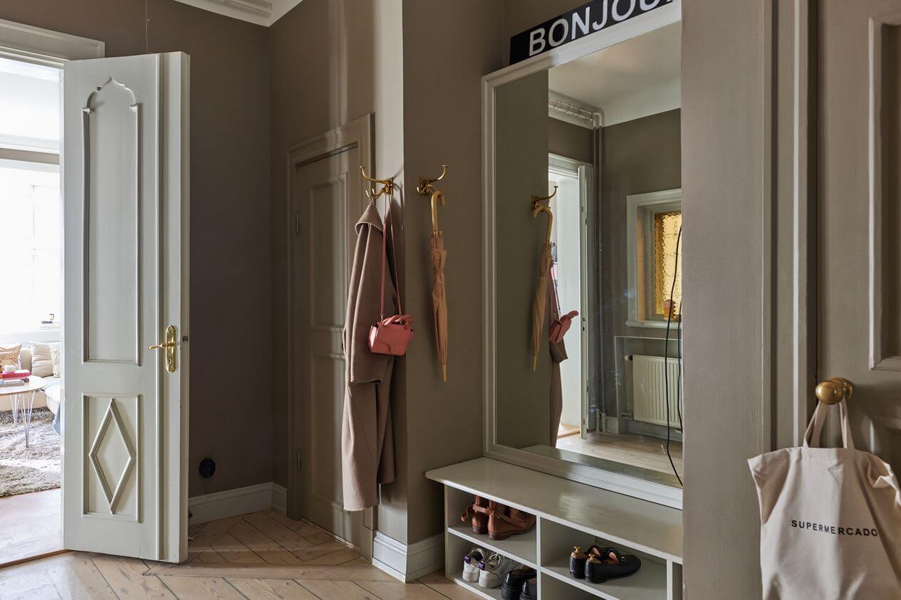 Light Brown Walls in a 17th Century Apartment in Sweden 22 hallway-built-in-shoe-coat-storage-light-brown-walls-nordroom