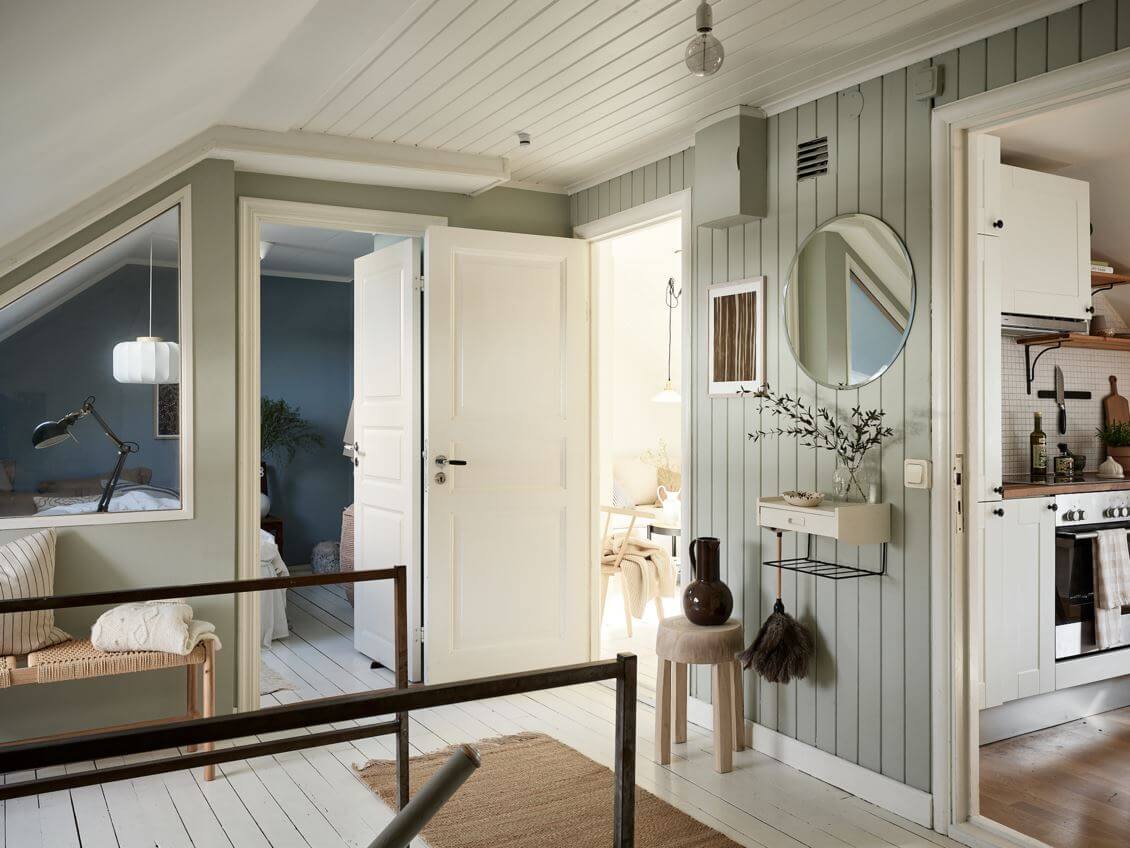 A White Scandinavian Attic Apartment 5 hallway-light-green-walls-attic-apartment-nordroom