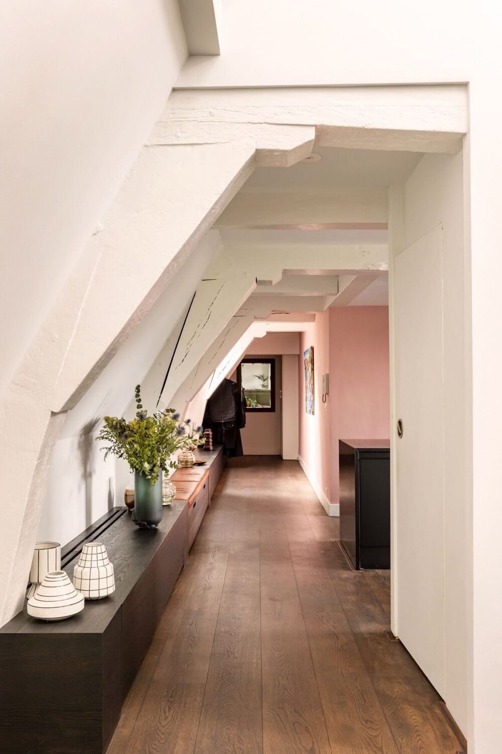 An Amsterdam Penthouse with Green Color Accents 8 hallway-slanted-ceiling-penthouse-apartment-nordroom