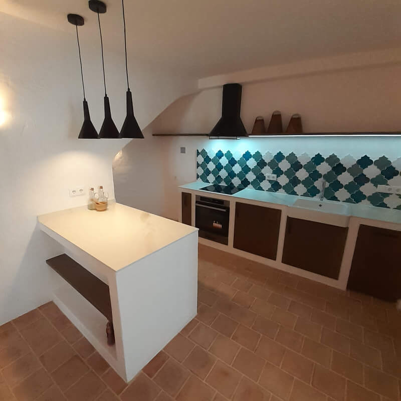 Casita Alborán: A Stylish Home in a Spanish Seaside Town 8 handmade-kitchen-terracotta-floor-black-pendants-nordroom