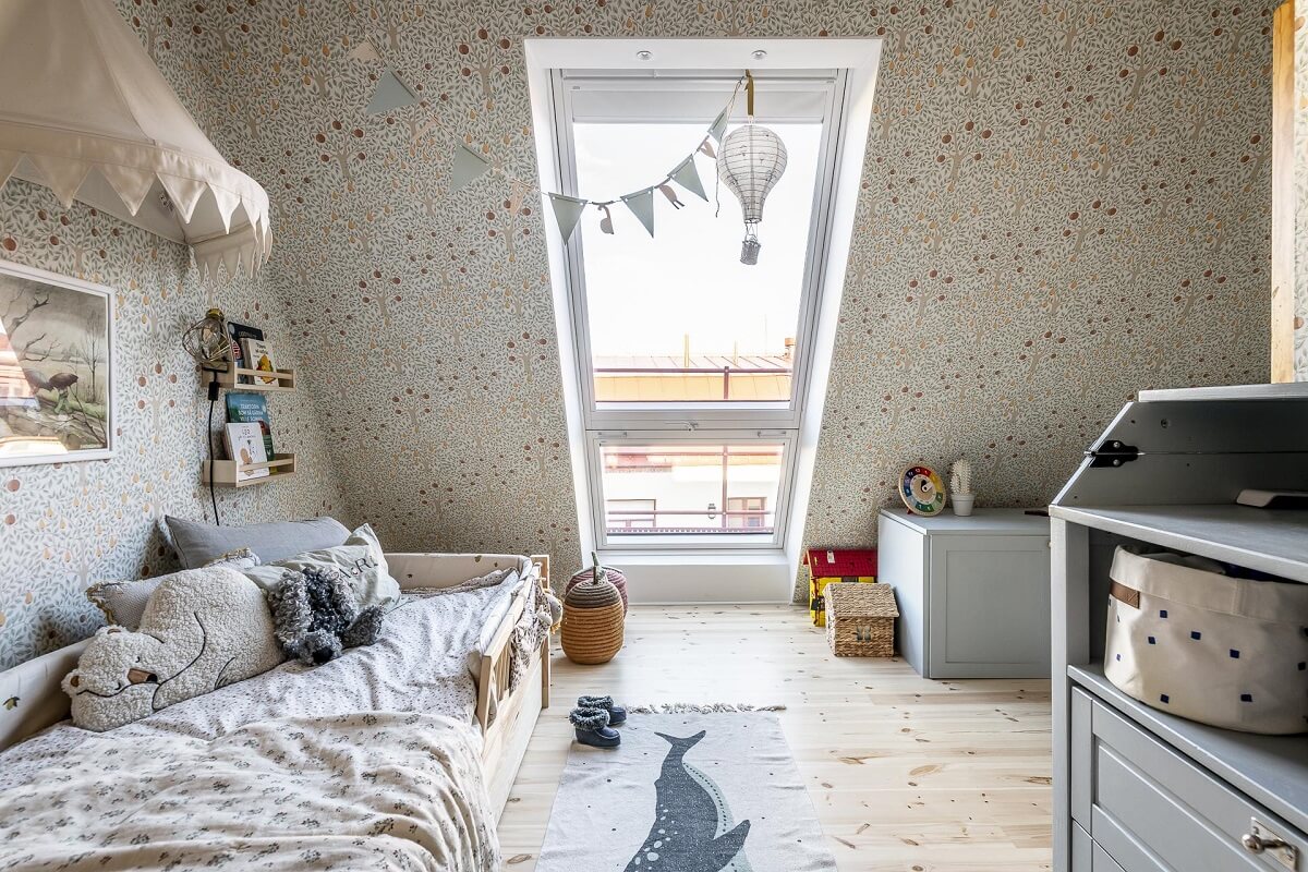 A Swedish Maisonette with a Blue Kitchen and Wallpaper 31 kids-bedroom-slanted-ceiling-tree-wallpaper-nordroom