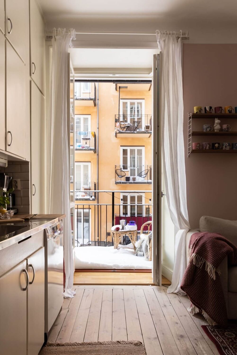 A Pink Living Room in a Scandinavian Apartment 11 kitchen-balcony-wooden-floor-boards-nordroom