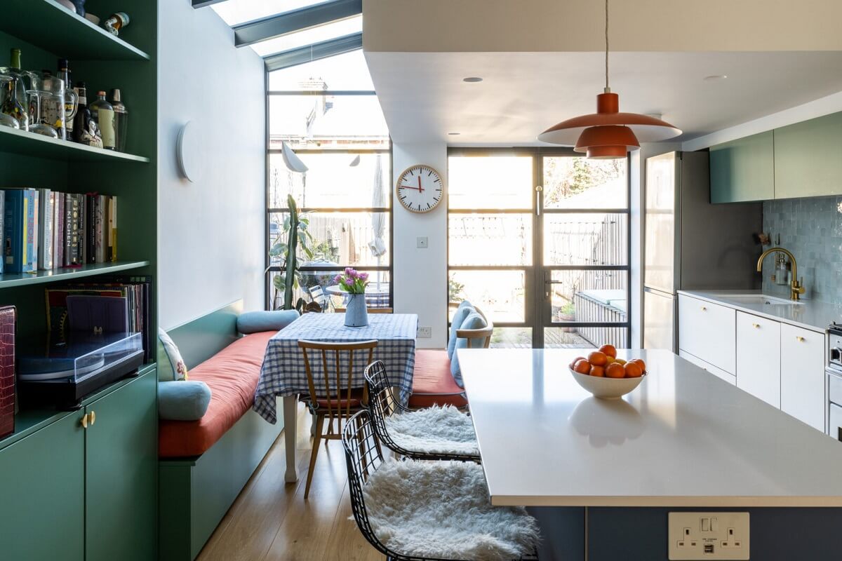Blue and Green Tones in a London Home 2 kitchen-dining-room-green-bookcase-skylight-nordroom