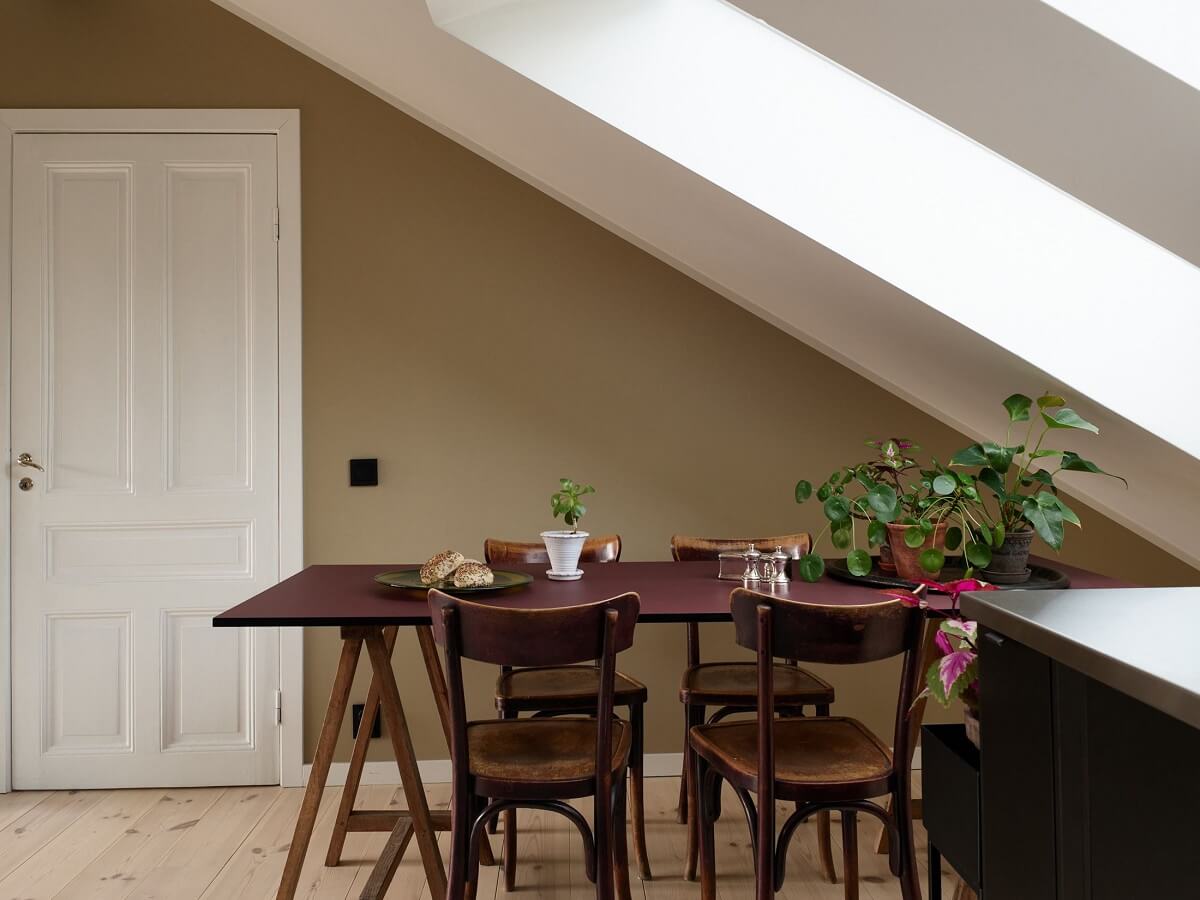 A Scandinavian Penthouse Apartment with Slanted Ceilings 5 kitchen-dining-table-slanted-ceiling-nordroom