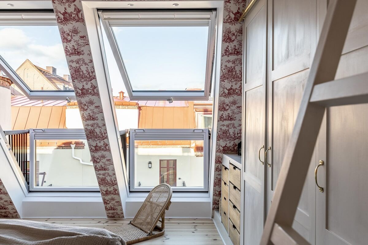 A Swedish Maisonette with a Blue Kitchen and Wallpaper 21 large-windows-built-in-wardrobes-bedroom-slanted-ceilings-nordroom