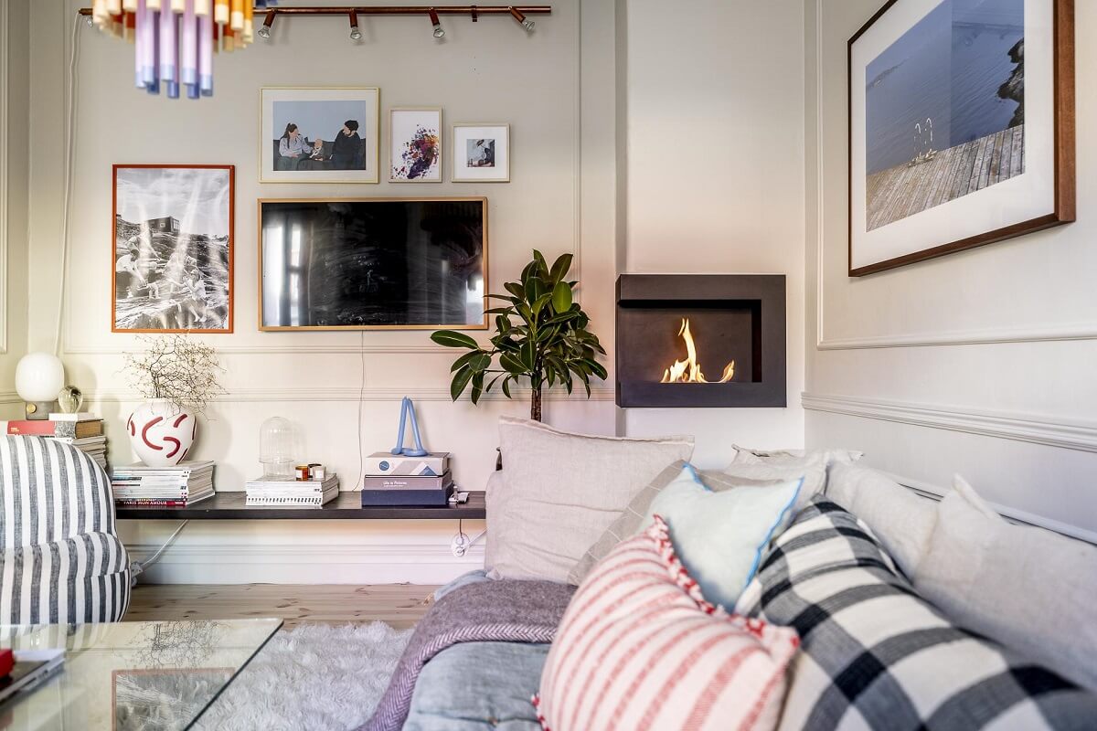 A Swedish Maisonette with a Blue Kitchen and Wallpaper 3 living-room-detail-corner-fireplace-beige-walls-nordroom