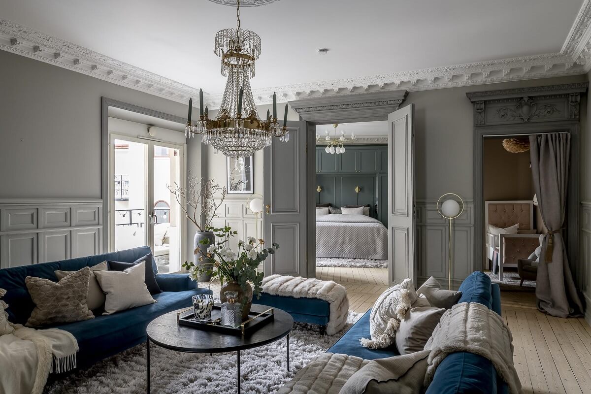 Gray Tones in a Classic Historic Scandinavian Home 2 living-room-gray-walls-blue-sofa-historic-elements-nordroom